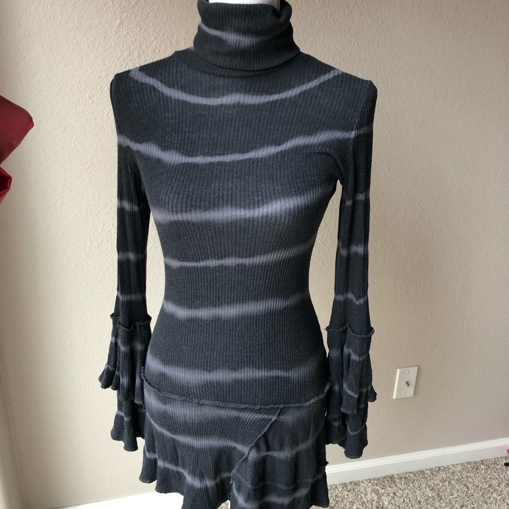 Long asymmetrical ruffled turtleneck